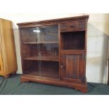 An Old Charm Linen Fold Oak Bookcase with Small Drawer Over Open Section and Base Cupboard Flanked