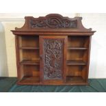 A Carved Oak Wall Hanging Shelved Cabinet with Centre Cupboard and Raised Gallery,