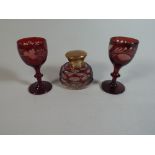 A Pair of Bohemian Overlaid Ruby Glasses and an Overlaid Ruby Glass Inkwell with Brass Lid
