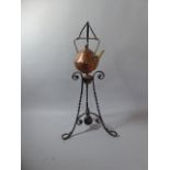 An Arts and Crafts Christopher Dresser Copper and Brass Spirit Kettle on Wrought Iron Floor Stand