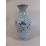 A Good Quality Oriental Blue and White Vase Decorated in Relief with Butterfly and Flowers.