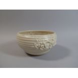 A Clarice Cliff Ribbed Bowl with Floral Decoration in Relief. 21cm Diameter.