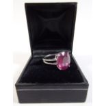 A 14k White Gold and Diamond Ring Set with an Oval Cut Ruby Approx 8.35ct. Diamonds approx 0.