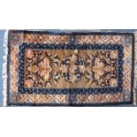 A Small Woven Chinese Woollen Rug, 95x53cms. on Blue and Beige Ground.