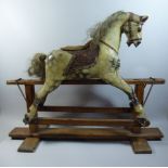 A Small Victorian Rocking Horse on Stained Pine H Frame,