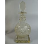 A Good Quality Cut Glass Globe Decanter on Square Foot with Starburst. 34cm High.