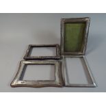 A Collection of Four Rectangular Silver Photo Frames,