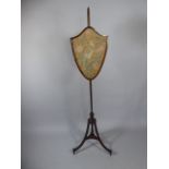 A Sheraton Style Mahogany Tripod Pole Screen with Embroidered Shield Shaped Screen Depicting Bird.