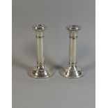 A Pair of Silver Candlesticks, Circular Stepped Bases to Turned Columns. Birmingham 1922. 16.