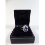 A 14k White Gold and Diamond Ring set with and Oval Cut Tanzanite Approx 3.57ct. Diamonds Approx 0.