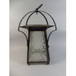 An Arts and Crafts Beaten Copper and Wrought Iron Lantern with Dimpled and Frosted Glass,