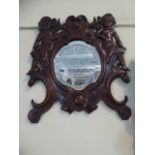 A Late 19th Century Italian Baroque Carved Walnut Wall Mirror with Two Putti Supported on Griffin