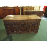 An Early Carved Oak Three Panel Blanket Chest with Hinged Lid,