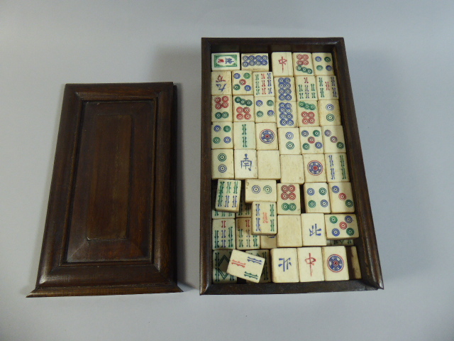 A Chinese Cased Mah Jong Set in Rectangular Wooden Box with Sliding Panelled Lid. 23x13.