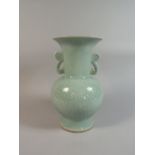 An Oriental Celedon Two Handled Vase with Underglazed Six Character Mark in Blue.