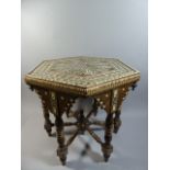 A Profusely Inlaid Islamic Hexagonal Table, Probably North African,