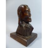 A 19th Century Carved Wood Portrait Bust, Probably Pacific Islands, on a Later Plinth.