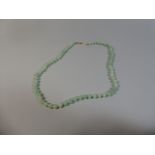 A String of Jade Beads.
