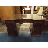 A Reverse Break Front Mahogany Writing Desk with Centre Long Drawers Flanked by Cupboard and Five