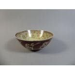 An Early 18th Century Chinese or Persian Lustre Bowl with Floral Decoration.