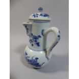 A Kangxi Period Blue and White Side Pouring Jug and Cover Decorated with Flowers. 18cm High.