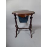 A Pretty Victorian Burr Walnut Ladies Work Table with Shaped Top Over Pull Out Wool Well. 56cm Wide.