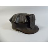 A Vintage American Moulded Leather Miners Helmet in Turtle Shell Design,
