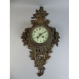 A Continental Brass Wall Clock with Naturalistic Pierced and Moulded Surround,