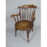 An Early 20th Century Beech Circular Seated Spindle Back Arm Chair.