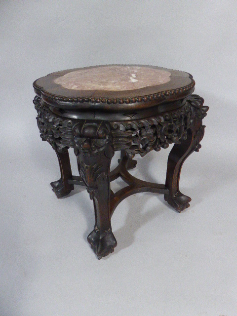 A Richly Carved and Pierced Oriental Hardwood Vase Stand with Inset Marble Top on Claw Feet. - Image 2 of 2