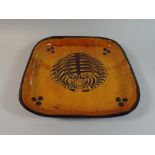 An Unusual Studio Pottery Dish. Orange and Incised Brown Glaze Depicting Stylised Tiger.