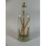 A 19th Century Folk Art 'God in a Bottle' 25cm high