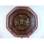 A Chinese Octagonal Red Lacquer Wedding Tray with Raised Pierced Gallery.