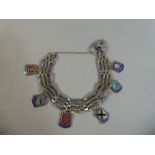 A Silver Gate Link Charm Bracelet with Various Enamelled and Silver Souvenir Charms for Lakeland,