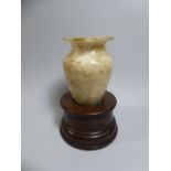 An Egyptian Carved Alabaster Cosmetics Jar of Archaic Form,