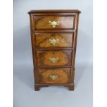 A 19th Century Walnut Chest of Four Drawers on Bracket Feet.