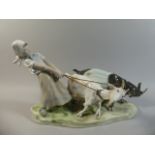 A Large Meissen Figural Group of Girl Holding Two Goats Straining at Their Leashes.