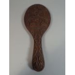 An Indian Hardwood Carved Hand Mirror.