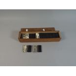 An Edwardian Cased Set of Double Nine Dominoes