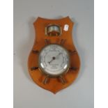 A Novelty Wall Hanging Marine Barometer/Thermometer in the Form of Ships Wheel On Wooden Plinth,