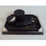 An Edwardian Silver Mounted Ebonised Gentleman's Dressing Set with Tray, Lidded Pots,