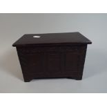 An Edwardian Box in the Form of a Three Panelled Coffer Chest with Hinged Lid, 22cm Wide by 11.