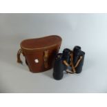 A Pair of Leather Cased Aloma Binoculars,