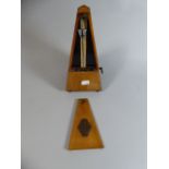 A French Walnut Cased Metronome,