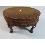 A Circular Upholstered Stool on Short Cabriole Legs,