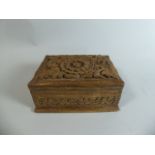 A Carved Indian Puzzle Box with Foliate Decoration,