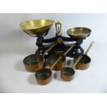 A Set of Brass Mounted Boots Kitchen Scales and a Graduated Set of Five Miniature Copper Saucepans