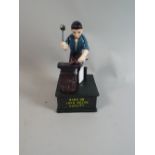 A Reproduction Cast Metal American Style Money Bank, Blacksmith,