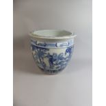 A Large Oriental Blue and White Glazed Stoneware Planter Decorated with Figures and Trees,