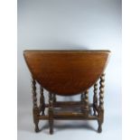 An Edwardian Oak Barley Twist Drop Leaf Gate Leg Table,